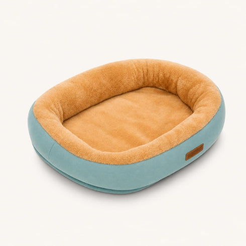 Corbeille pour chat bleu vert avec intérieur en peluche beige ultra douce et rebords rembourrés pour un confort optimal.