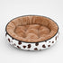 Coussin pour chaton rond en peluche douce marron avec rebords rembourrés et motifs tachetés, conçu pour des siestes confortables et rassurantes.