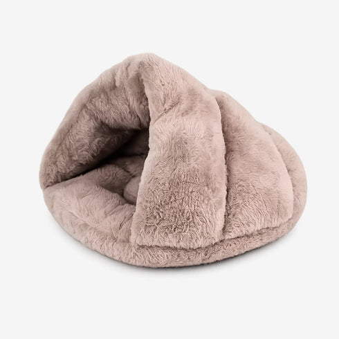 Coussin pour chat chauffant en peluche beige, forme cocon, présenté en studio sur fond blanc, mettant en valeur son design doux et enveloppant