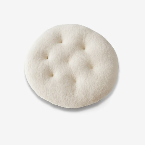 Coussin rond en polaire écru pour panier à chat, présenté isolé sur fond clair.