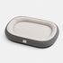 Grand lit pour chat gris avec rebords rembourrés et coussin intérieur blanc, conçu pour offrir un couchage spacieux et confortable.