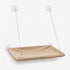 Hamac de fenêtre pour chat beige suspendu avec ventouses transparentes et câbles métalliques, présenté sur fond neutre en studio.
