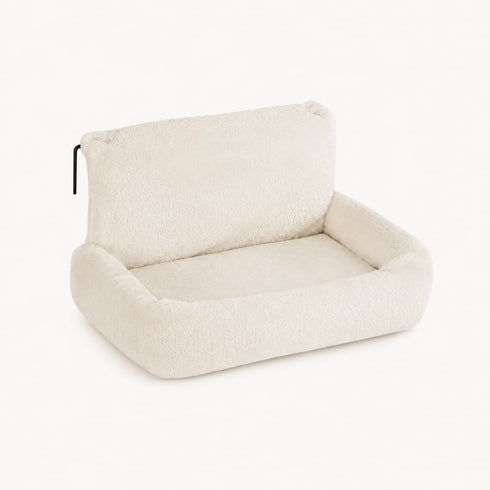 Lit radiateur pour chat en peluche beige clair avec rebords moelleux, conçu pour offrir un couchage chaud et confortable en hiver.