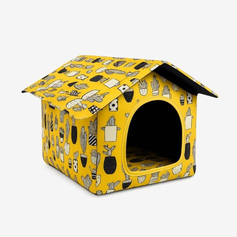Niche pour chat extérieur hiver jaune à motifs, vue studio sur fond blanc.