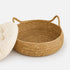 Panier à chat imitation osier beige avec coussin crème amovible et poignées intégrées pour un entretien facile et un confort optimal.