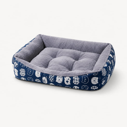 Panier chaud pour chat bleu à motifs avec coussin gris ultra moelleux et rebords rembourrés pour un confort optimal.