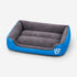 Panier chauffant pour chat bleu et gris avec rebords rembourrés et surface douce, idéal pour offrir un couchage chaud et confortable.