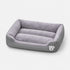 Panier chauffant pour chat gris avec rebords rembourrés et surface douce, idéal pour offrir un couchage chaud et confortable.