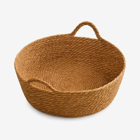 Panier rond en osier vide vu de dessus, avec poignées intégrées, présenté sur fond blanc.