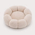Petit coussin pour chat en peluche beige, couchage rond moelleux et confortable.